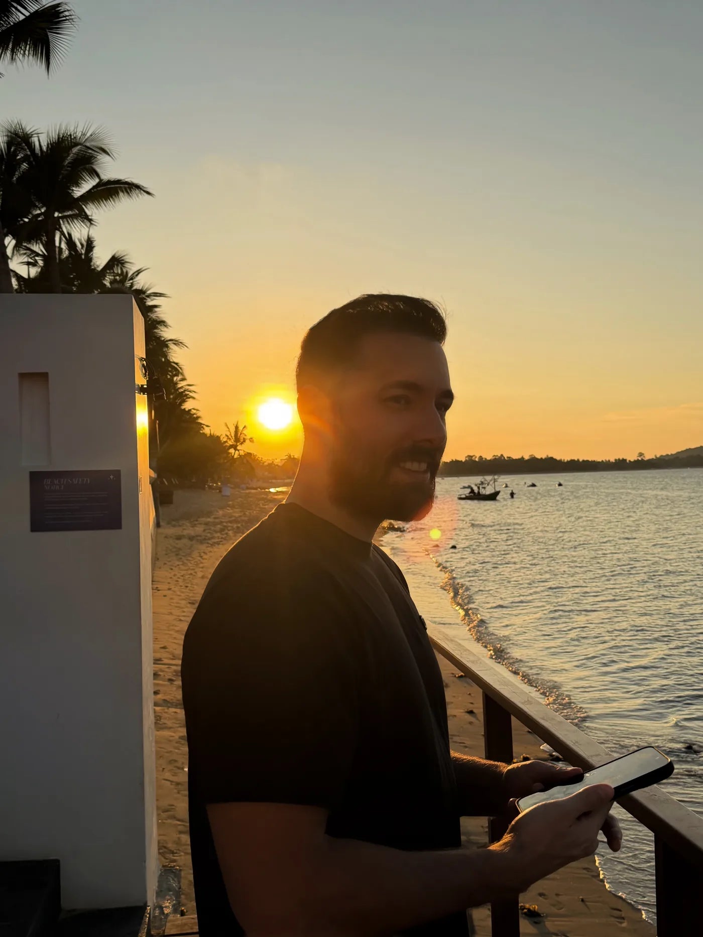 Faheem after the transformation, relaxed on the beach in a golden sunset