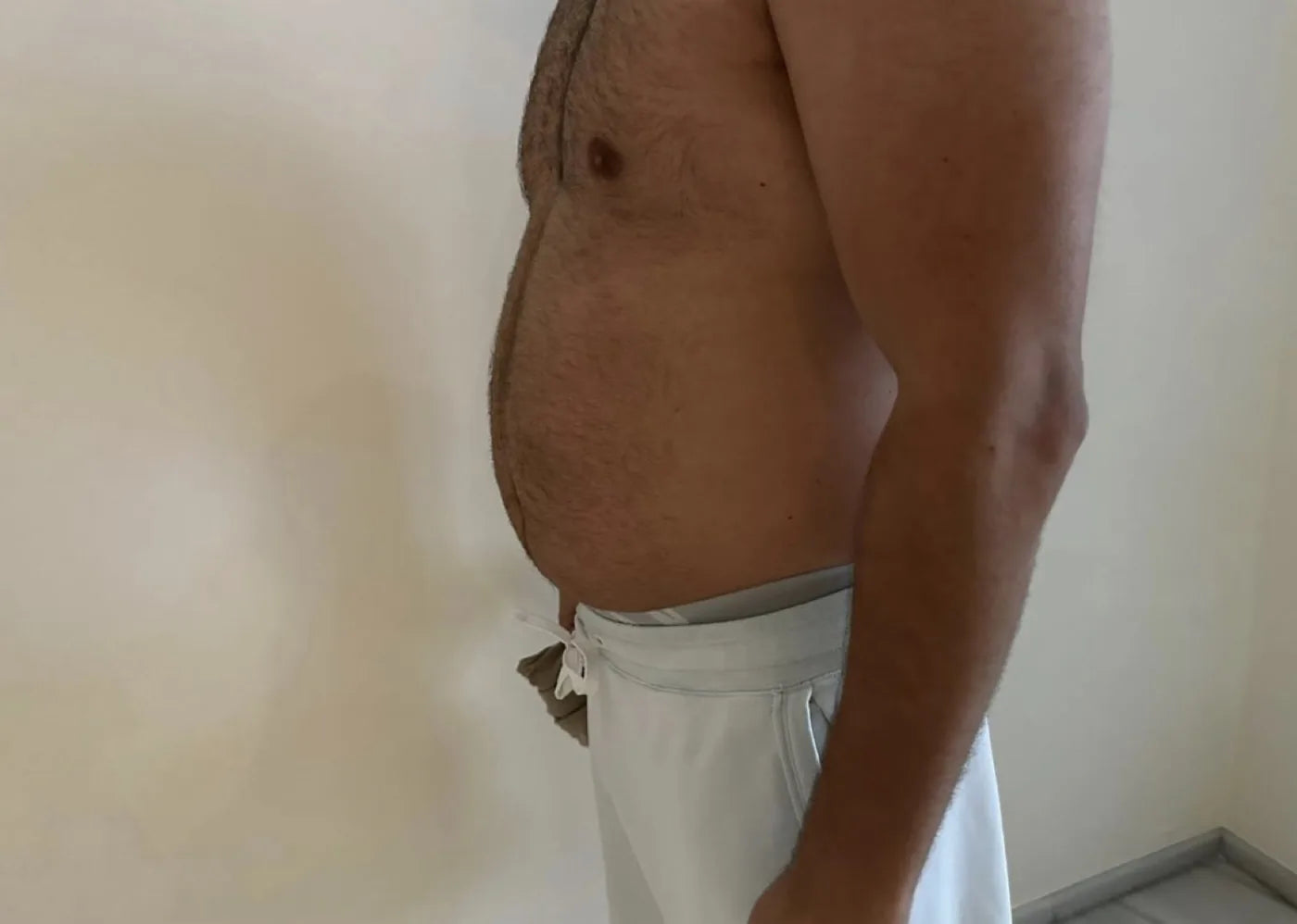 Faheem before: hard evening stomach, side view