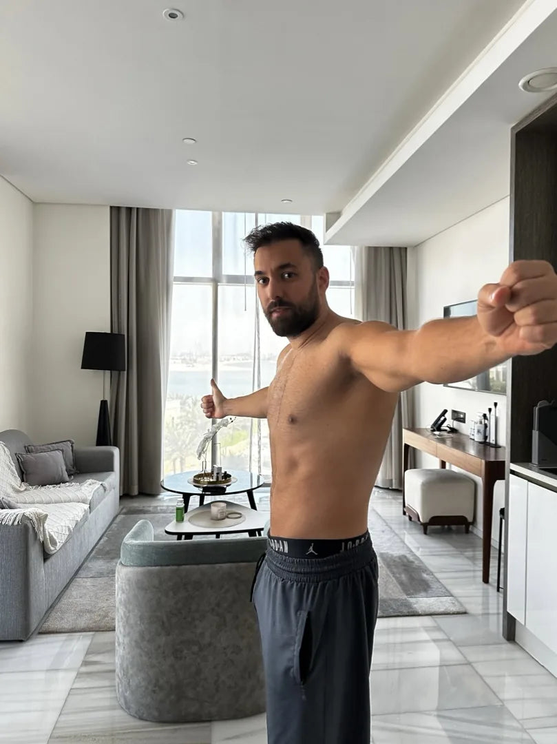 Faheem after: thumbs up, living room